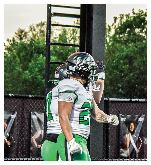 Two football players wearing Vista jerseys and holding hands. AI generated content