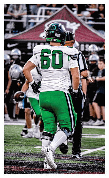 A young man wearing a football jersey with the name Vista on the back. AI generated content