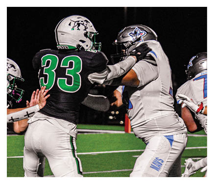 Two football players celebrating a touchdown with one player jumping in the air. AI generated content