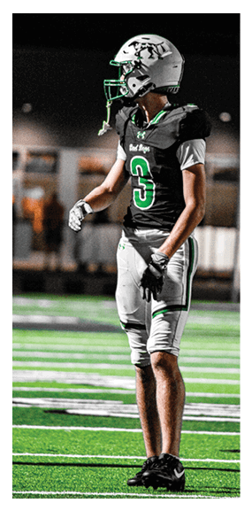 A football player is kneeling on the field, wearing a green jersey and a helmet. AI generated content
