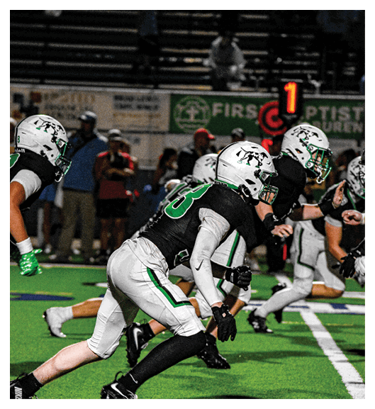 Two football players wearing Vista jerseys and holding hands. AI generated content