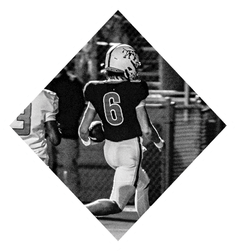A football player wearing a black jersey with the number 16 on it is holding a football. AI generated content