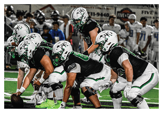 A group of football players wearing headphones and smiling. AI generated content