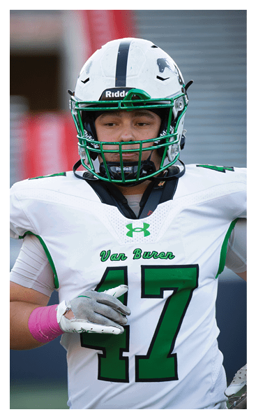 A young man wearing a football jersey with the name Vista on the back. AI generated content