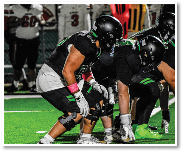 Two football players from the Vista team are standing on the field. AI generated content