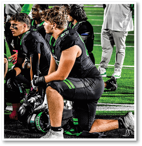 Two football players from the Vista team are standing on the field. AI generated content