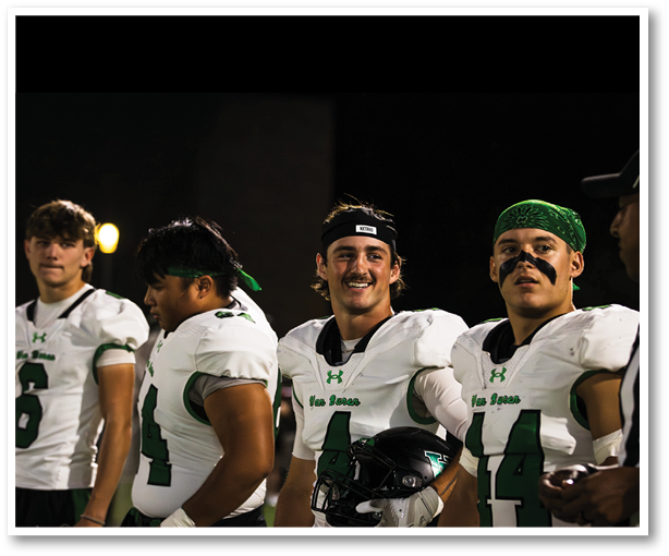 Two football players from the Vista team are standing on the field. AI generated content