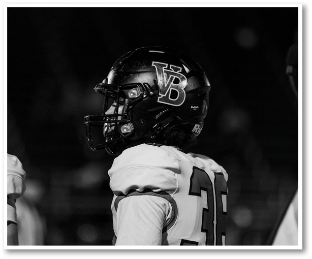 Two football players from the Vista team are standing on the field. AI generated content