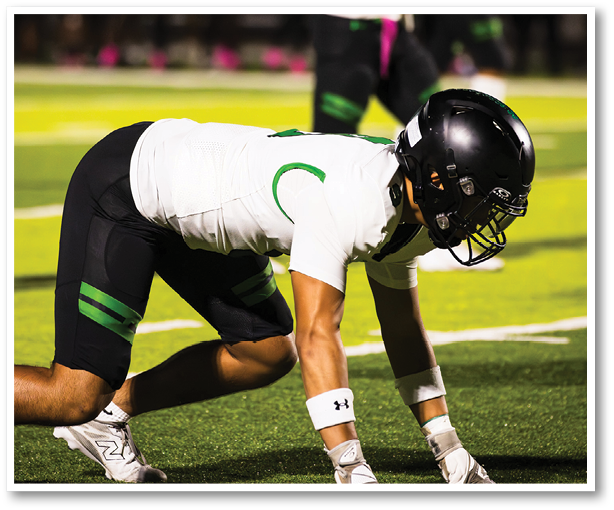 A group of people, including a referee, are gathered on a field. AI generated content