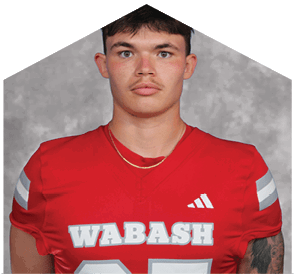 A young man wearing a white jersey with the number 10 on it. Description generated by AI