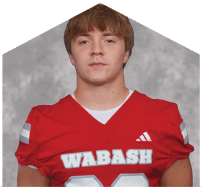 A young man wearing a white jersey with the number 10 on it. Description generated by AI