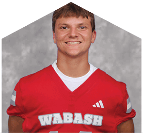 A young man wearing a white jersey with the number 10 on it. Description generated by AI