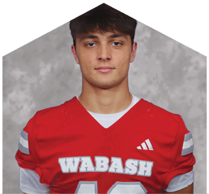 A young man wearing a white jersey with the number 10 on it. Description generated by AI