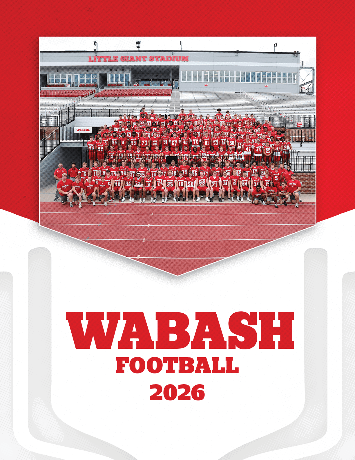 A large group of people wearing red sports uniforms is posed for a team photo on a football field with bleachers and a stadium building in the background, with bold red text below reading varsity football 2026. Description generated by AI
