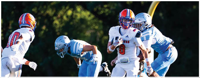 A football player is sliding on the ground. Description generated by AI