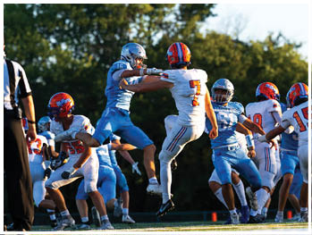A football player running on the field. Description generated by AI