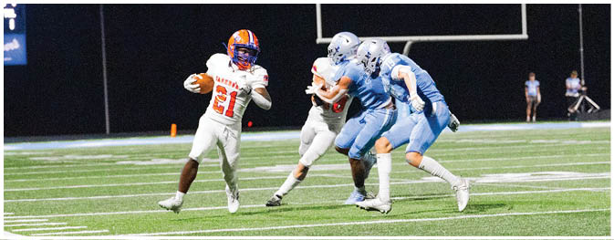 A football player is sliding on the ground. Description generated by AI