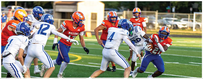 A football player is sliding on the ground. Description generated by AI