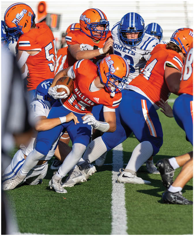 A group of football players wearing black and white uniforms. Description generated by AI