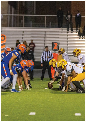 A football player running on the field. Description generated by AI
