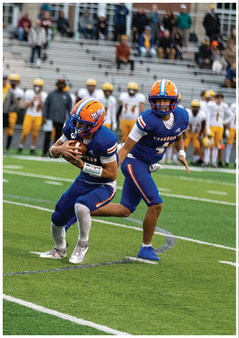 A football player running on the field. Description generated by AI