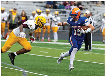A football player running on the field. Description generated by AI