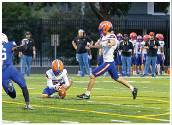A football player running on the field. Description generated by AI
