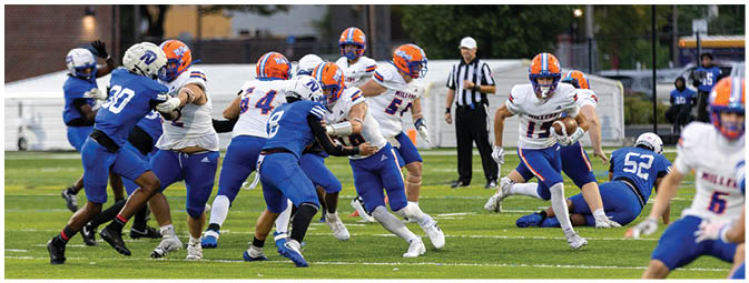 A football player is sliding on the ground. Description generated by AI