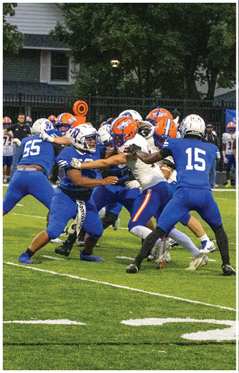 A football player running on the field. Description generated by AI