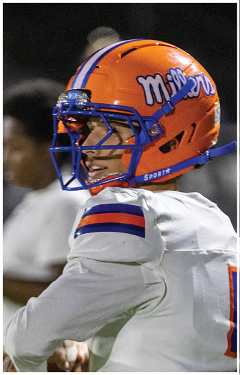 A football player running on the field. Description generated by AI