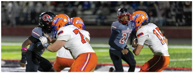 A football player is sliding on the ground. Description generated by AI