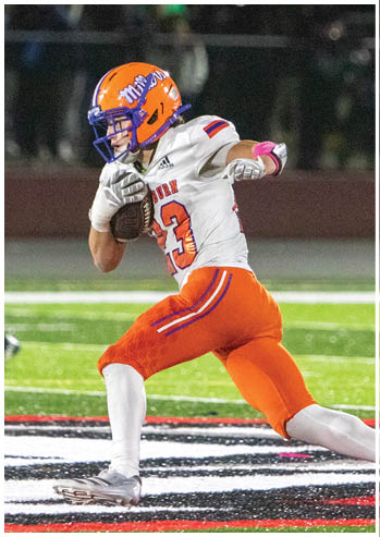 A football player running on the field. Description generated by AI