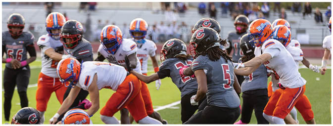 A football player is sliding on the ground. Description generated by AI