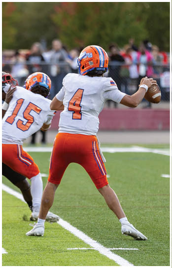 A football player running on the field. Description generated by AI