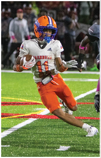 A football player running on the field. Description generated by AI