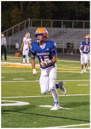 A football player running on the field. Description generated by AI
