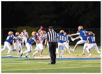A football player running on the field. Description generated by AI