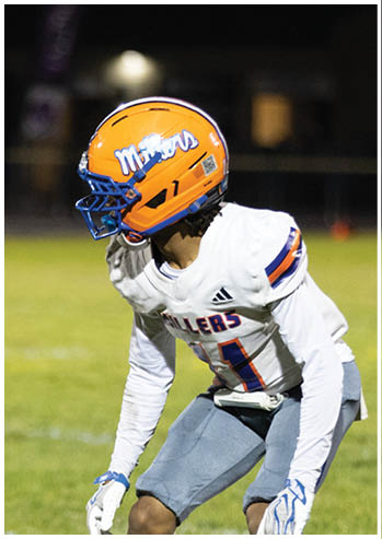 A football player running on the field. Description generated by AI