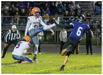 A football player running on the field. Description generated by AI