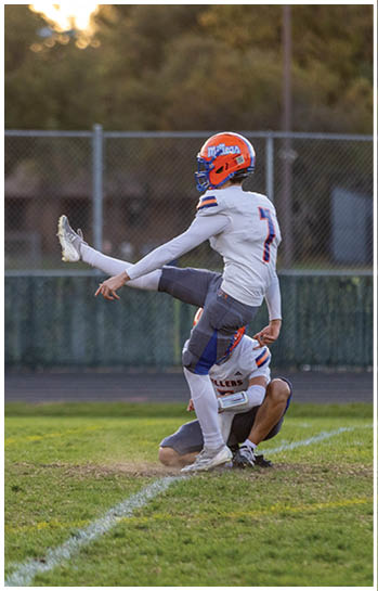 A football player running on the field. Description generated by AI