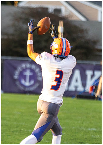 A football player running on the field. Description generated by AI