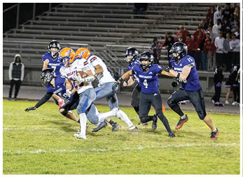 A football player running on the field. Description generated by AI