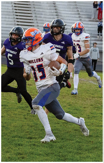 A football player running on the field. Description generated by AI