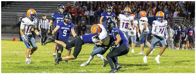 A football player is sliding on the ground. Description generated by AI