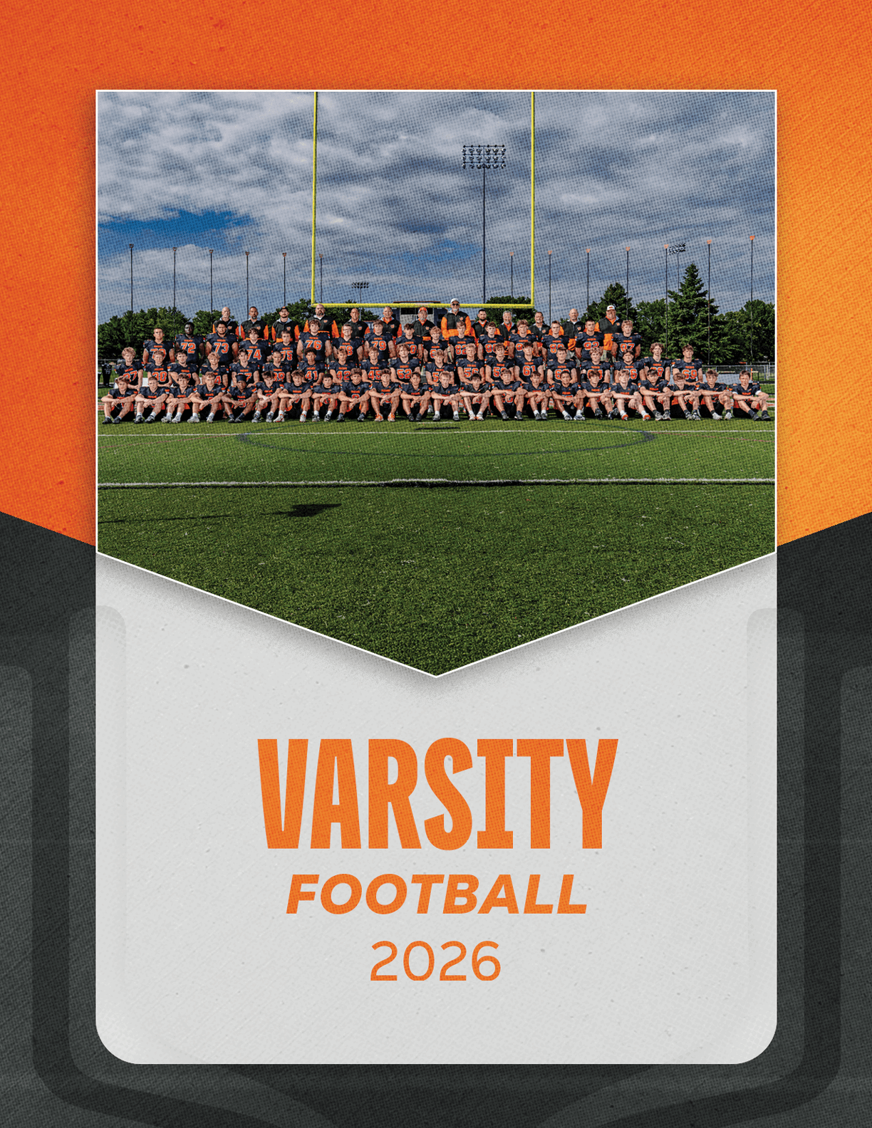 A large group of people wearing matching sports uniforms is seated on a football field under goalposts with the text varsity football 2026 below them on an orange and gray background. Description generated by AI