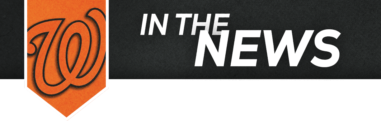 The graphic features a stylized orange “W" logo next to the bold white text "IN THE NEWS" on a black background. Description generated by AI