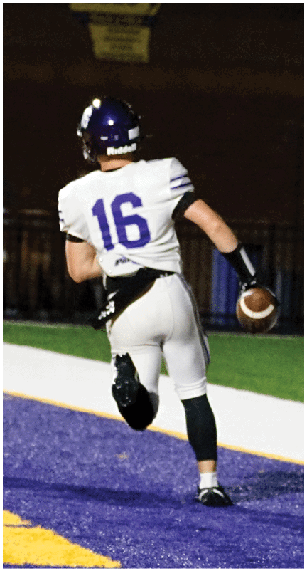 A football player running on the field. Description generated by AI