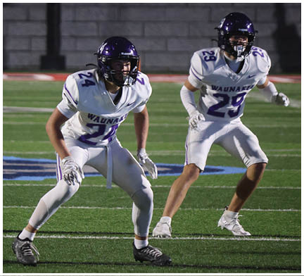 A football player running on the field. Description generated by AI
