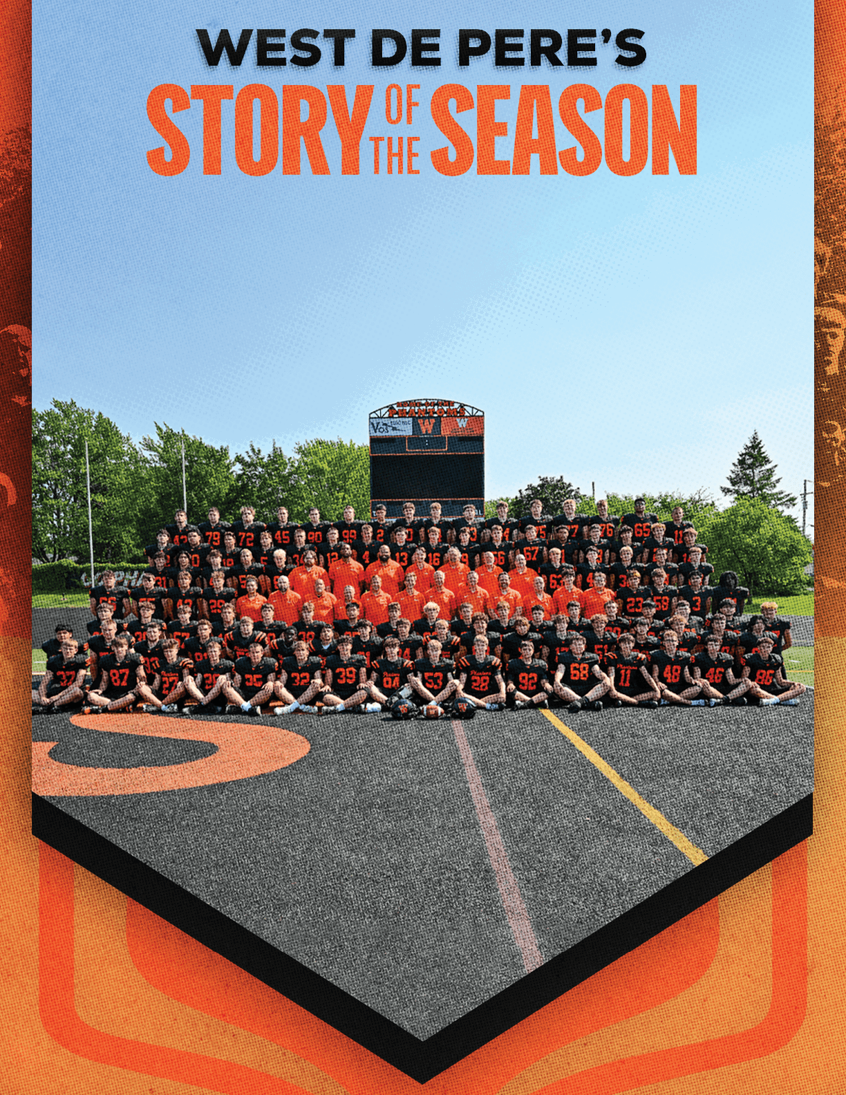 A large group of people wearing black and orange sports uniforms pose together on a football field with a scoreboard and trees in the background under a clear blue sky. Description generated by AI