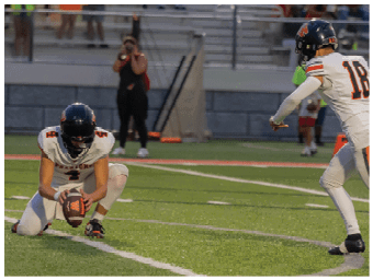 A football player running on the field. Description generated by AI